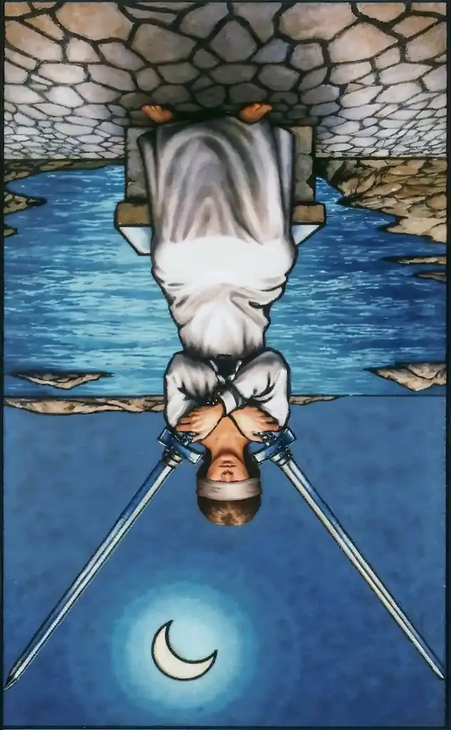 2 de Espadas invertida en el tarot